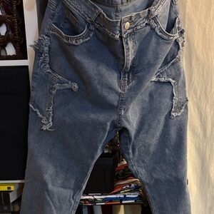 SHEIN Curve Distressed Blue Flare Jeans for Women.